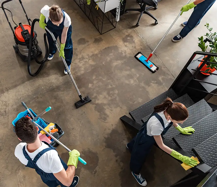 Tidy Team crew providing janitorial services in an office in Pompano Beach