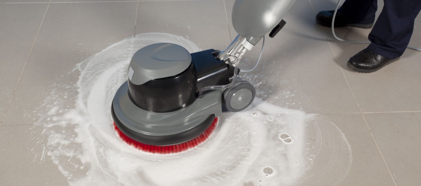 Floor buffer polishing a floor during commercial floor cleaning in Davie