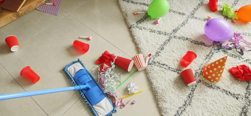 Mop and party cups on a floor before commercial cleaning in Fort Lauderdale