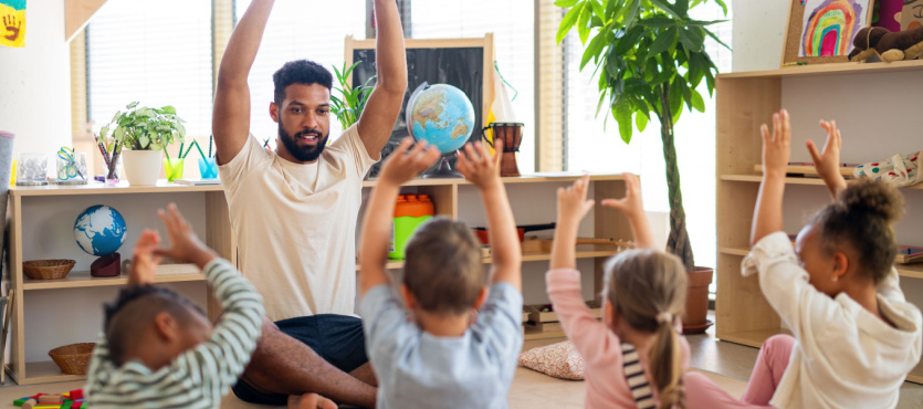 Teacher and children in a clean child care center kept up by janitorial services in Pompano Beach