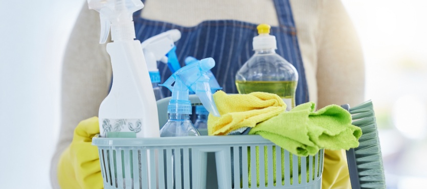 Caddy of cleaning supplies for a holiday commercial cleaning checklist in Fort Lauderdale