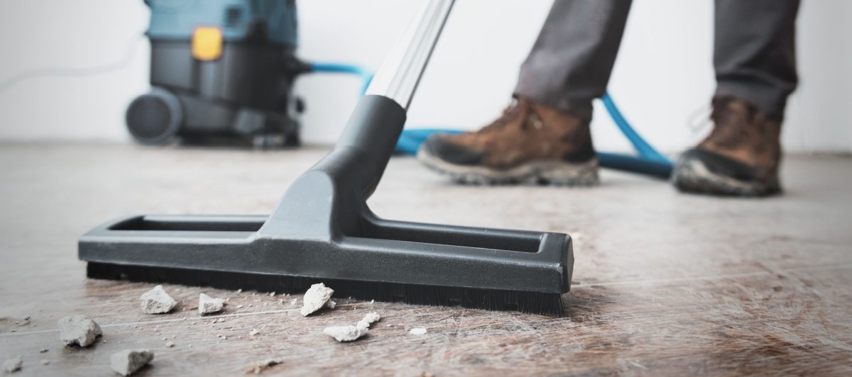 Vacuuming debris during construction site cleaning services in Plantation