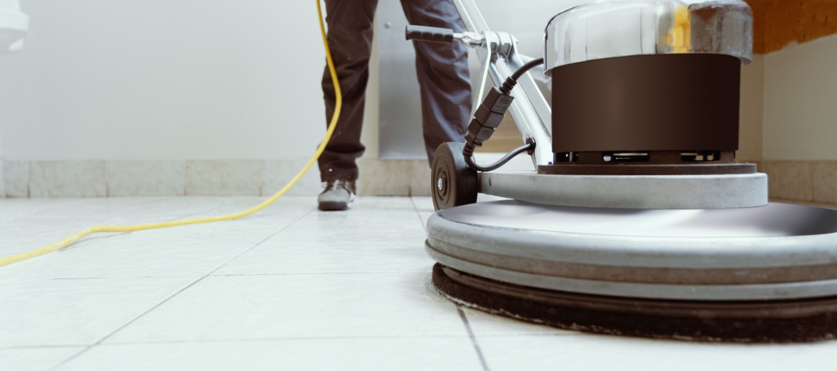 Floor buffer restoring a tile floor during commercial floor cleaning in Coral Springs