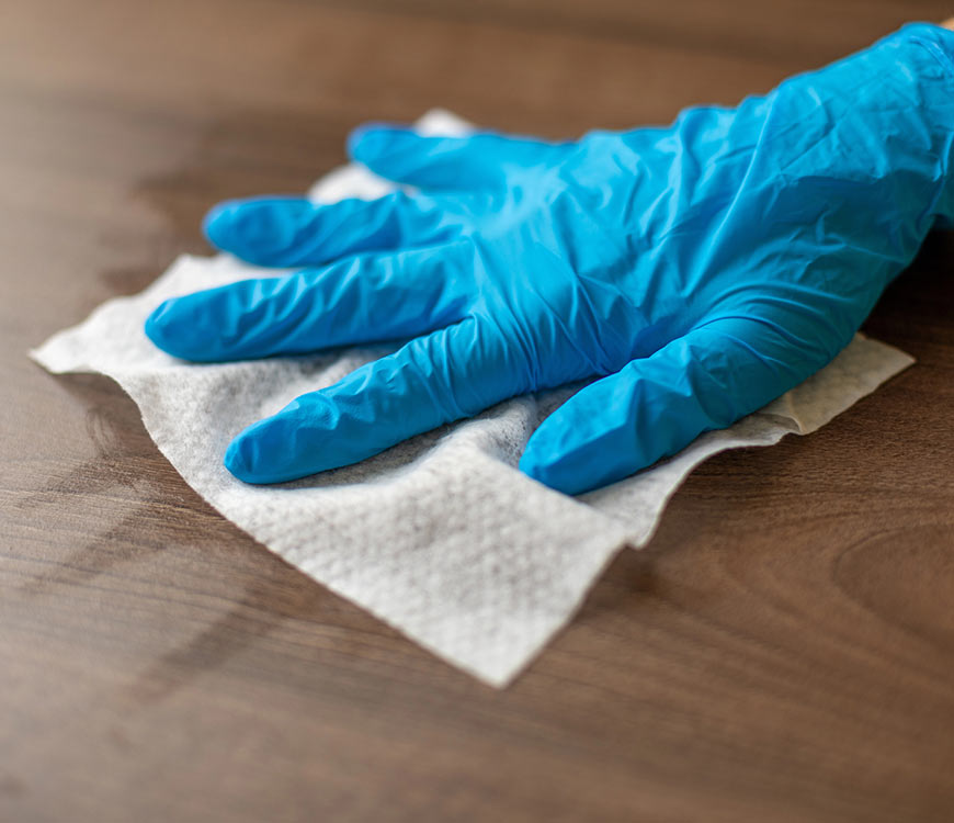 A desk being cleaned as part of janitorial services in Coral Springs, FL